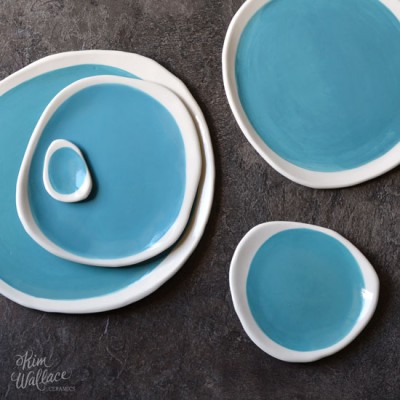 Handmade ceramic plates in aqua