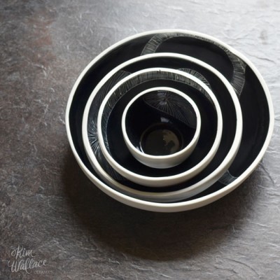 Nest of black ceramic bowls by Kim Wallace